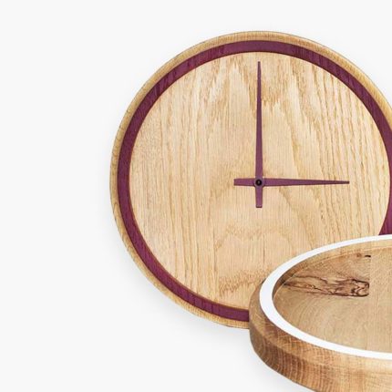Wooden wall clocks with minimalist design and purple accents.