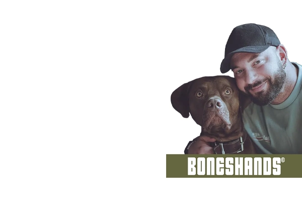 Man with dog and Boneshands logo on white background.